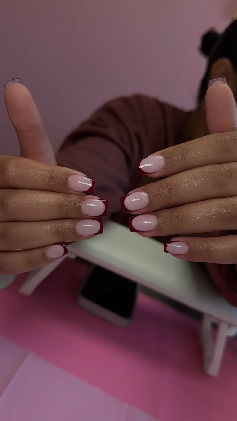 Deep burgundy red french tip nails on short square shape