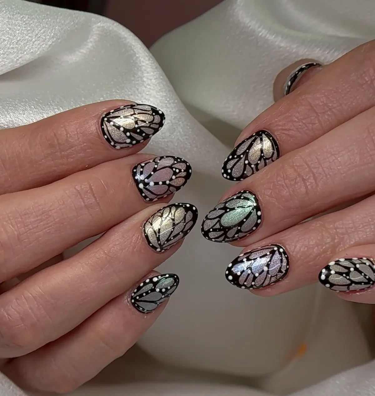 Iridescent nails with butterfly nail art at Polished by Kim The Woodlands