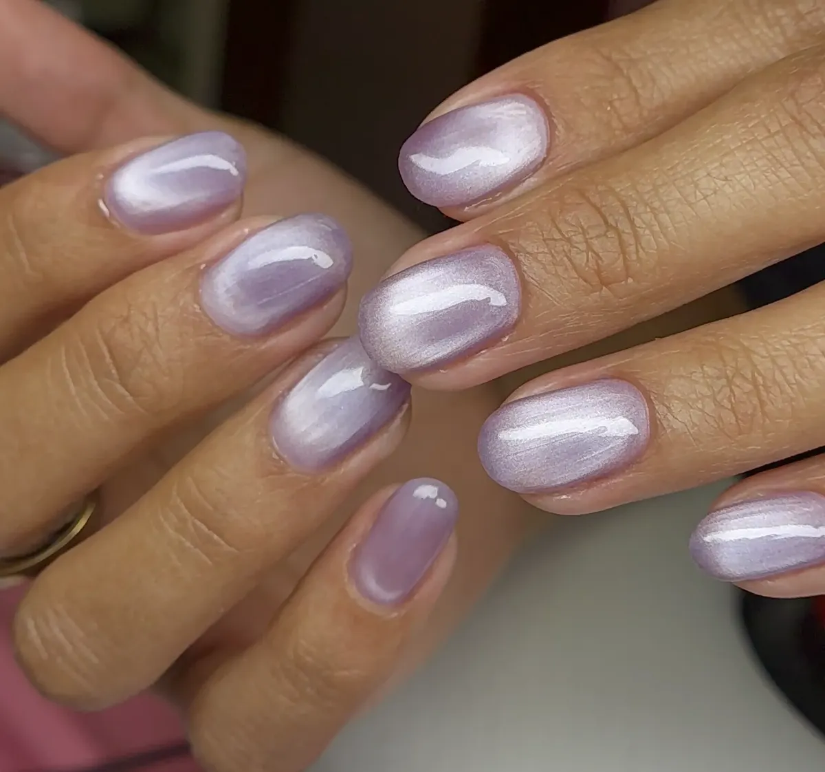 Shimmering lavender cat eye short oval nails at Polished by Kim