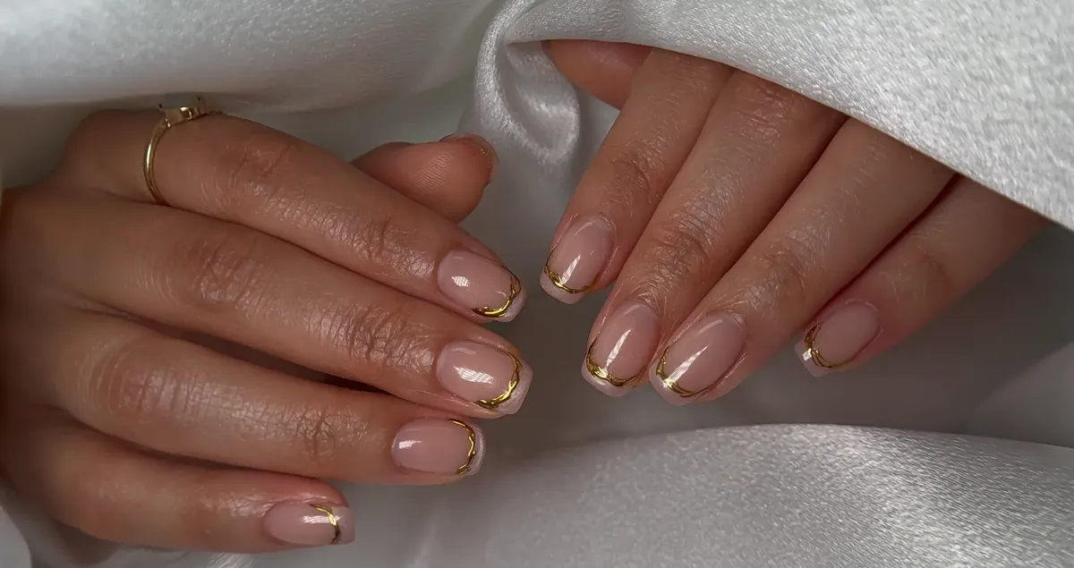 Nude nails with gold abstract French outline at Polished by Kim