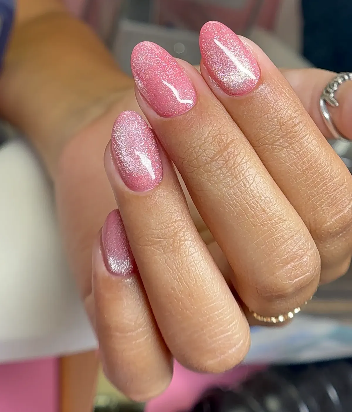 Pink cat eye almond nails with magnetic shimmer at Polished by Kim