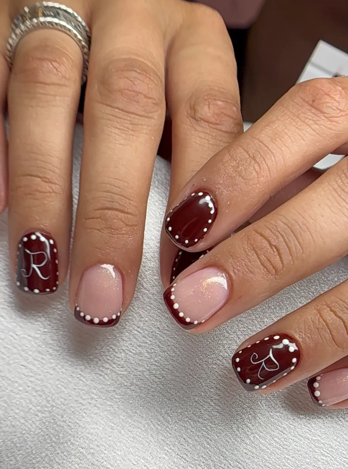 Burgundy and blush pink square French nails with white dot accents by Polished by Kim