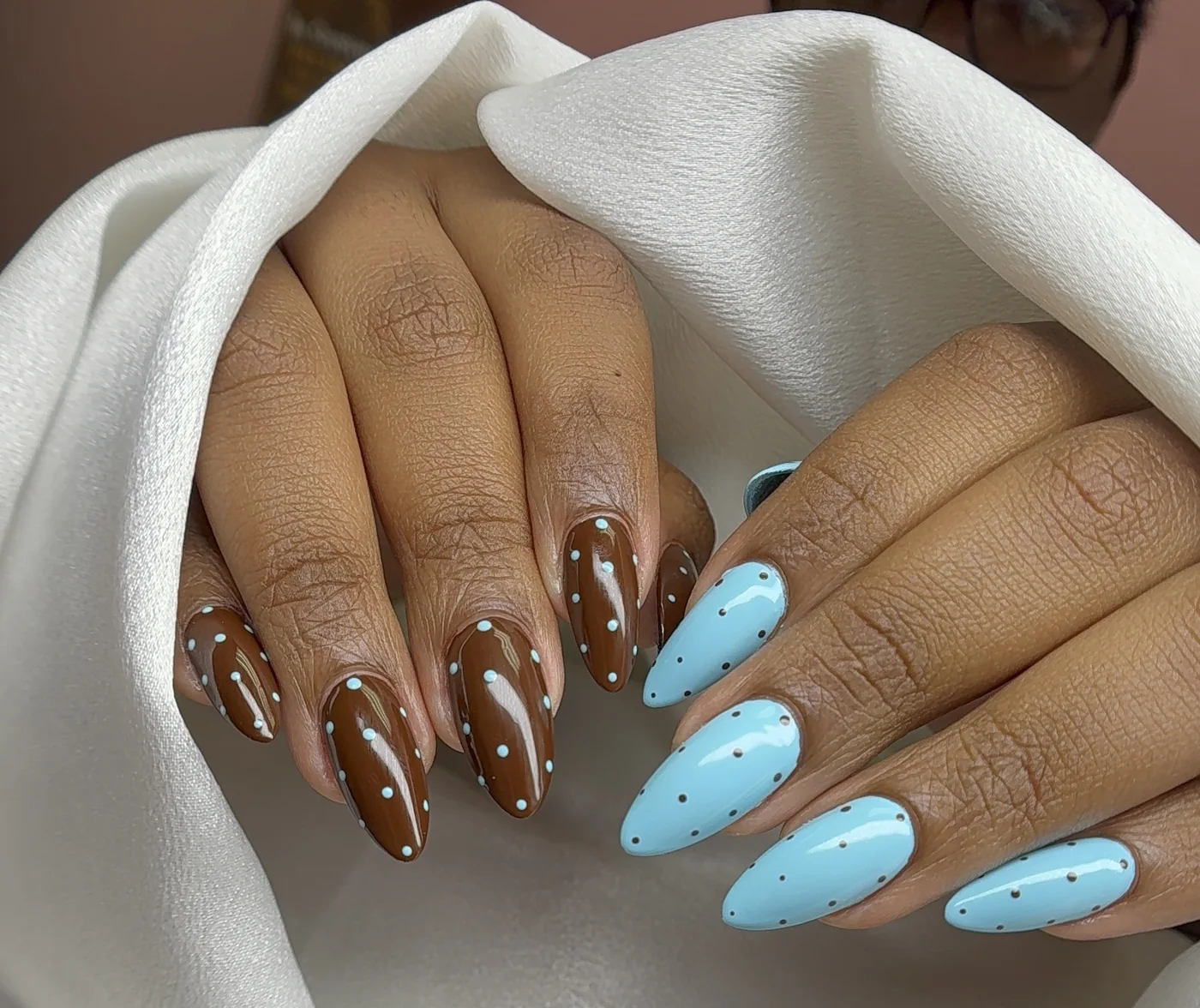 Blue and brown Gel-X almond nails with contrasting polka-dot art by Polished by Kim