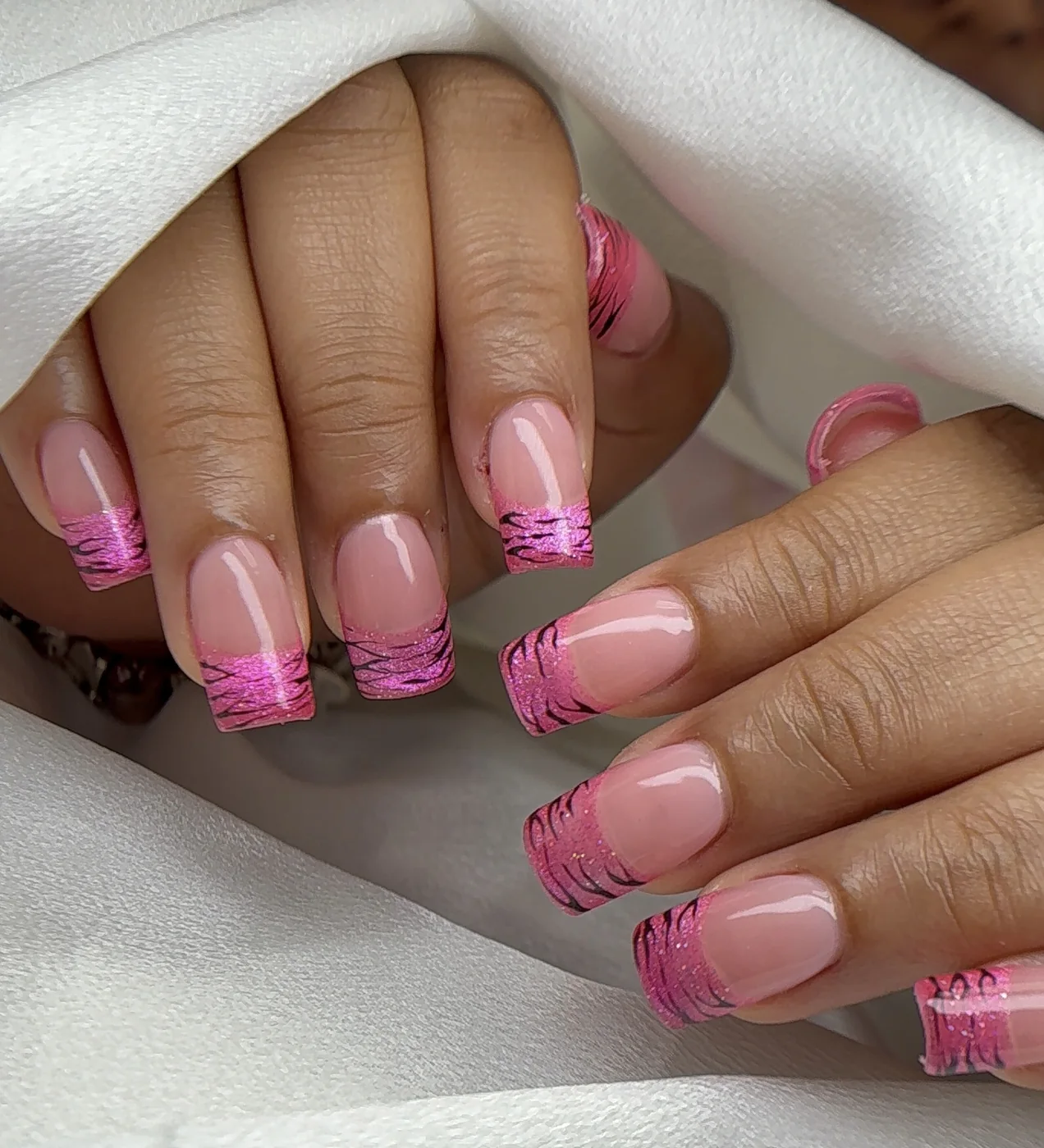 Pink Gel-X square nails with chrome zebra French tips by Polished by Kim