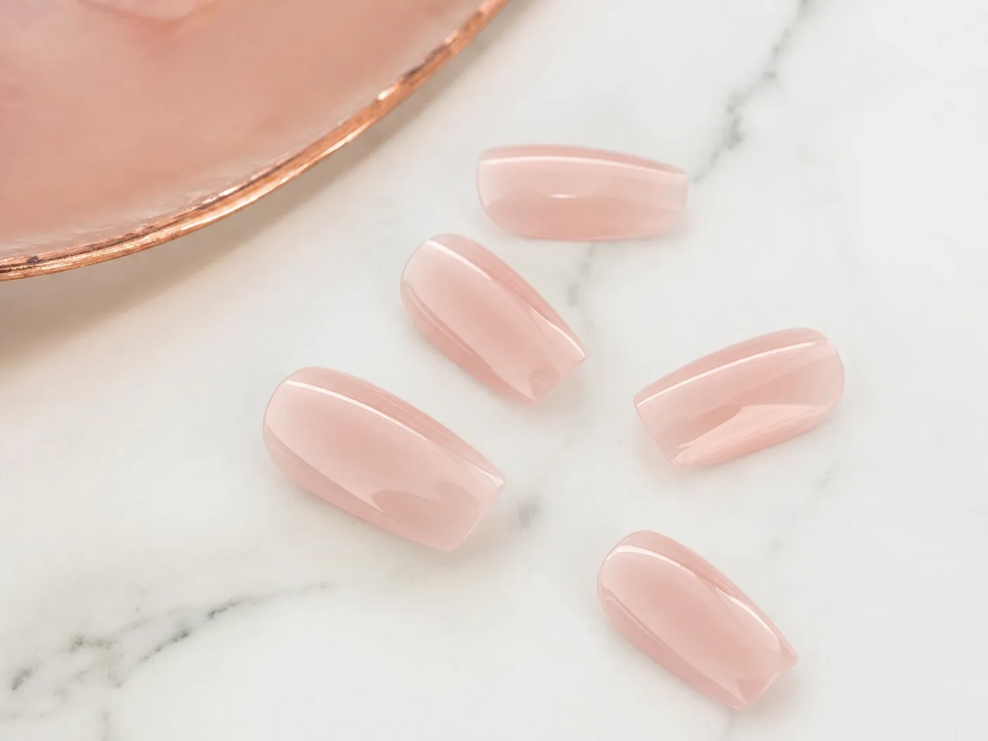 Gel X extension nails with a glossy sheer pink finish by Polished by Kim