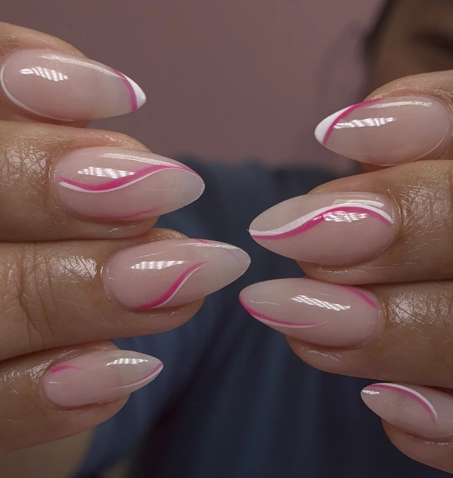 Sheer nude almond nails with fine diagonal pink and white French-tip linework by Polished by Kim