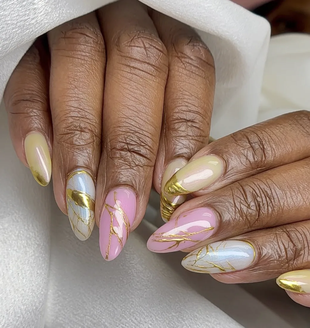 Pink marble almond nails with gold foil by Polished by Kim